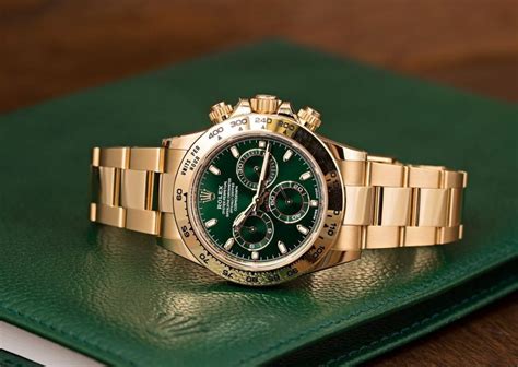 gold rolex with green|gold Rolex with green face.